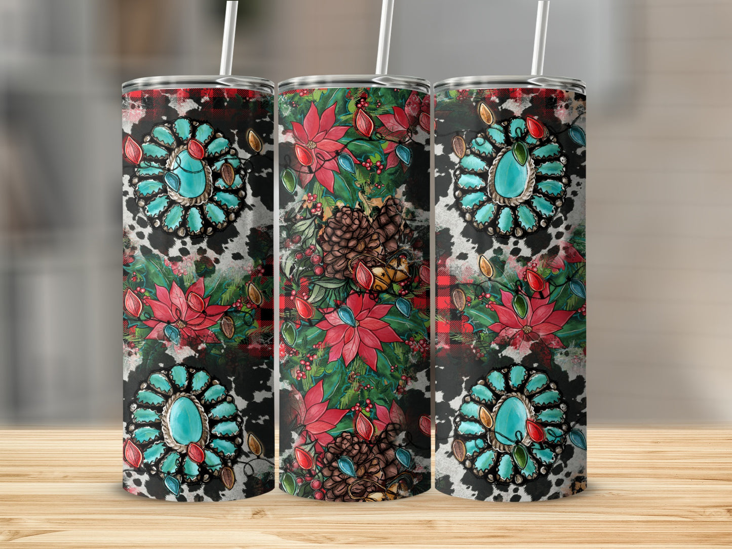 Three tumblers with turquoise gemstone and floral Christmas designs on wood surface.