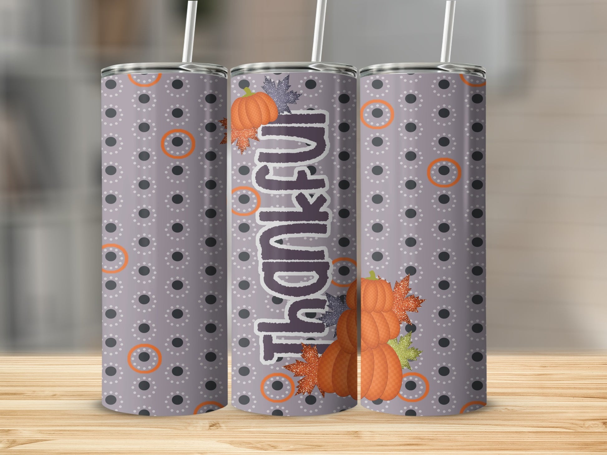 Trio of tumblers with "Thankful" text and autumn leaf design.