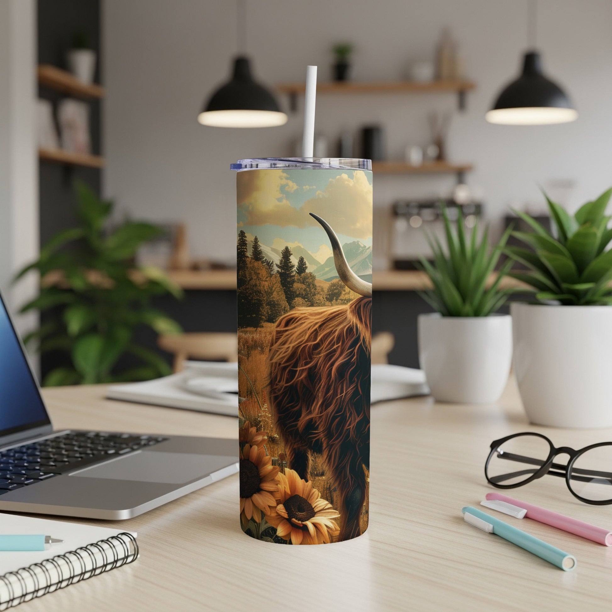 Highland cow with sunflowers on a skinny tumbler with straw.