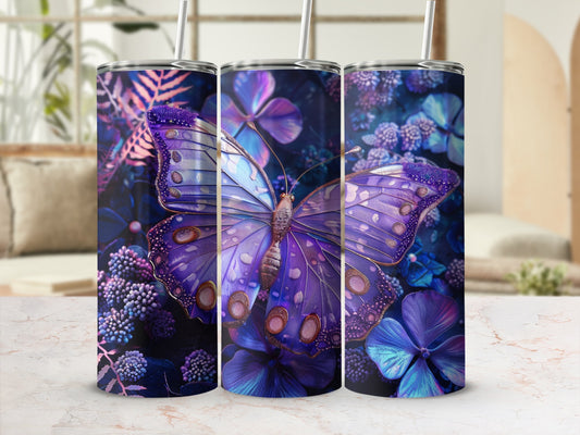 Purple butterfly and flowers tumbler with straw on marble surface.