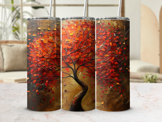 Abstract painting of a tree with red and orange leaves on a tumbler.