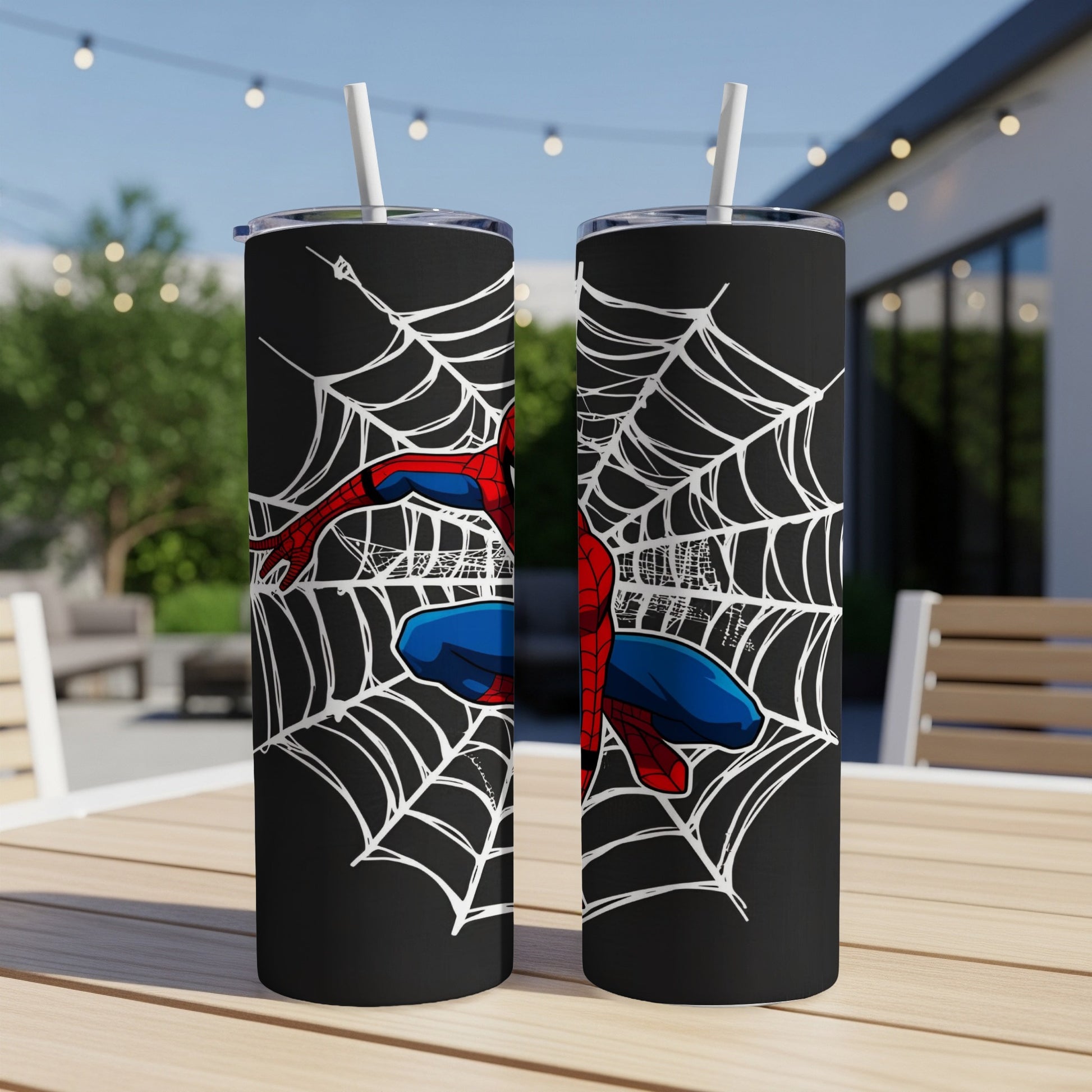 Two black tumblers with Spider-Man on a white web design.
