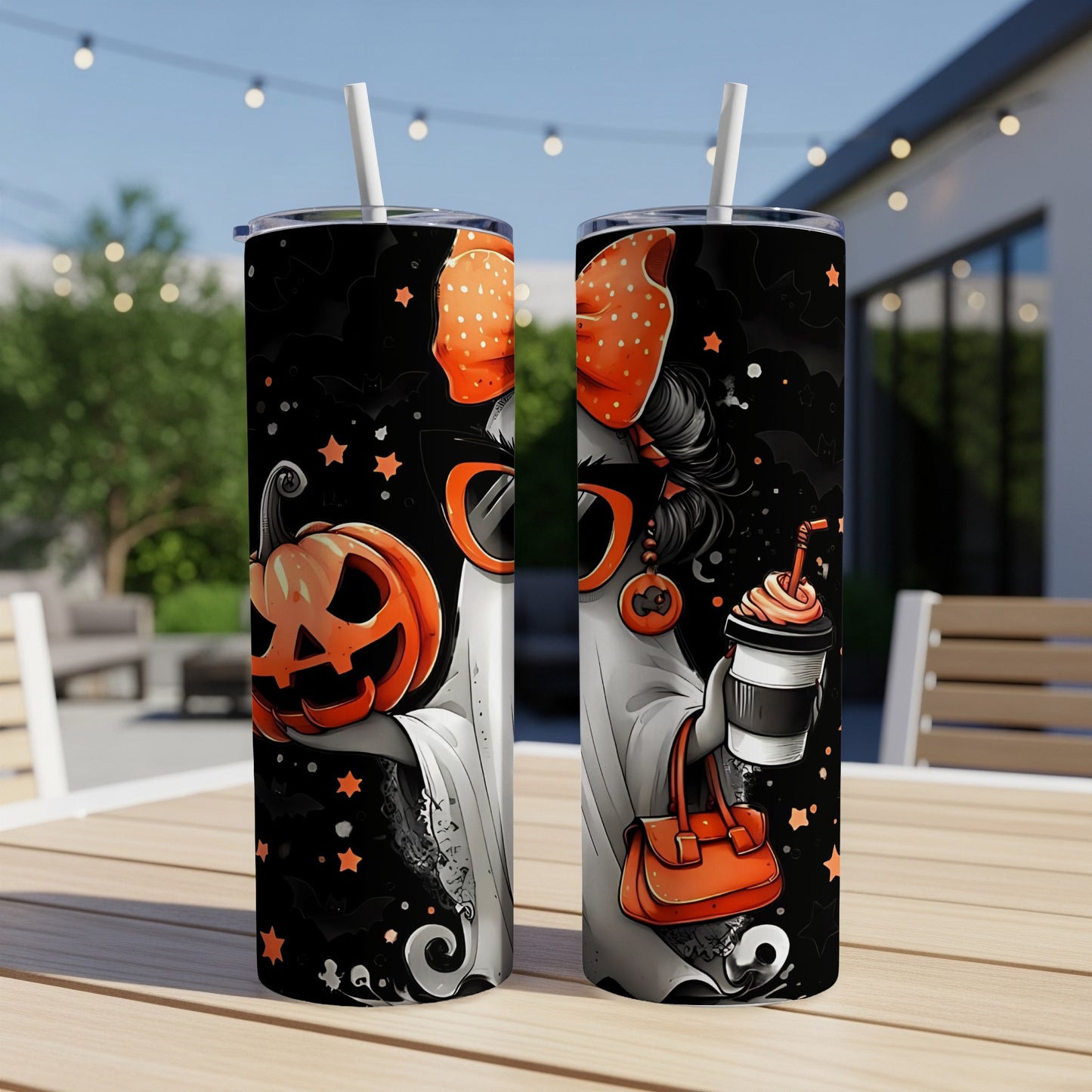 Two tumblers with Halloween ghost, pumpkin, and bat designs, one holding a pumpkin, the other a coffee.
