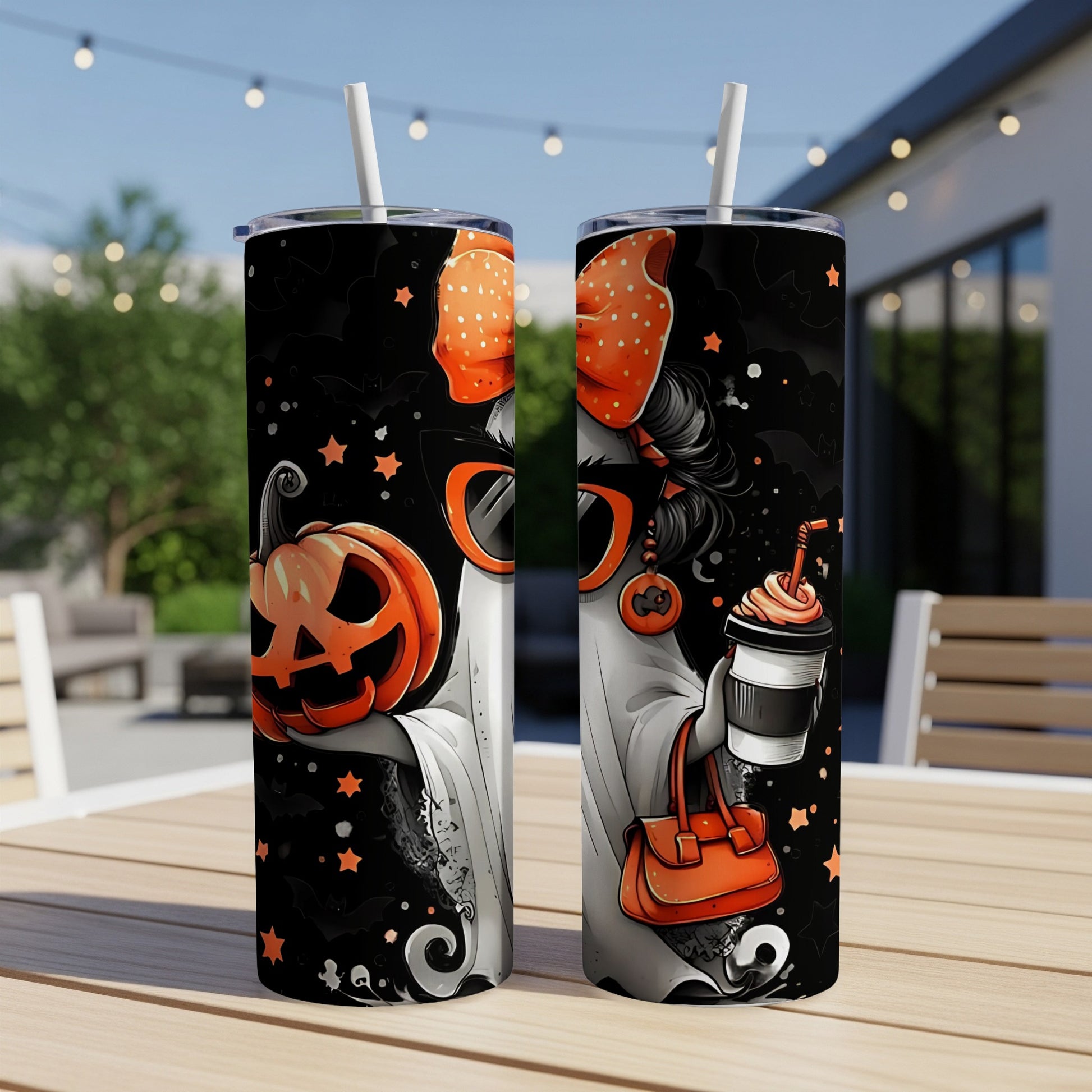 Two tumblers with Halloween ghost, pumpkin, and bat designs, one holding a pumpkin, the other a coffee.