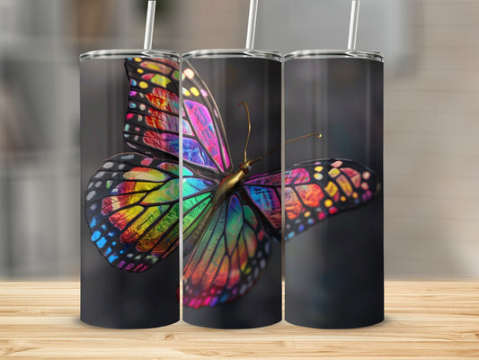 Three tumblers featuring a vibrant, colorful butterfly design.