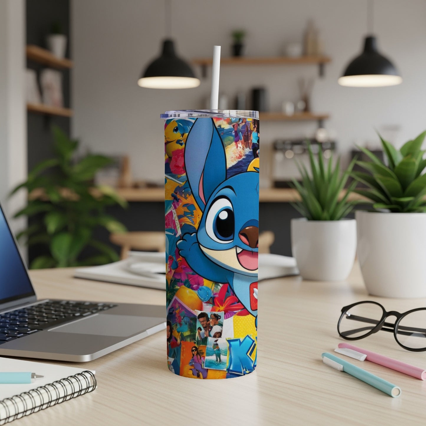 Blue Stitch character with colorful collage on a tall, skinny tumbler.