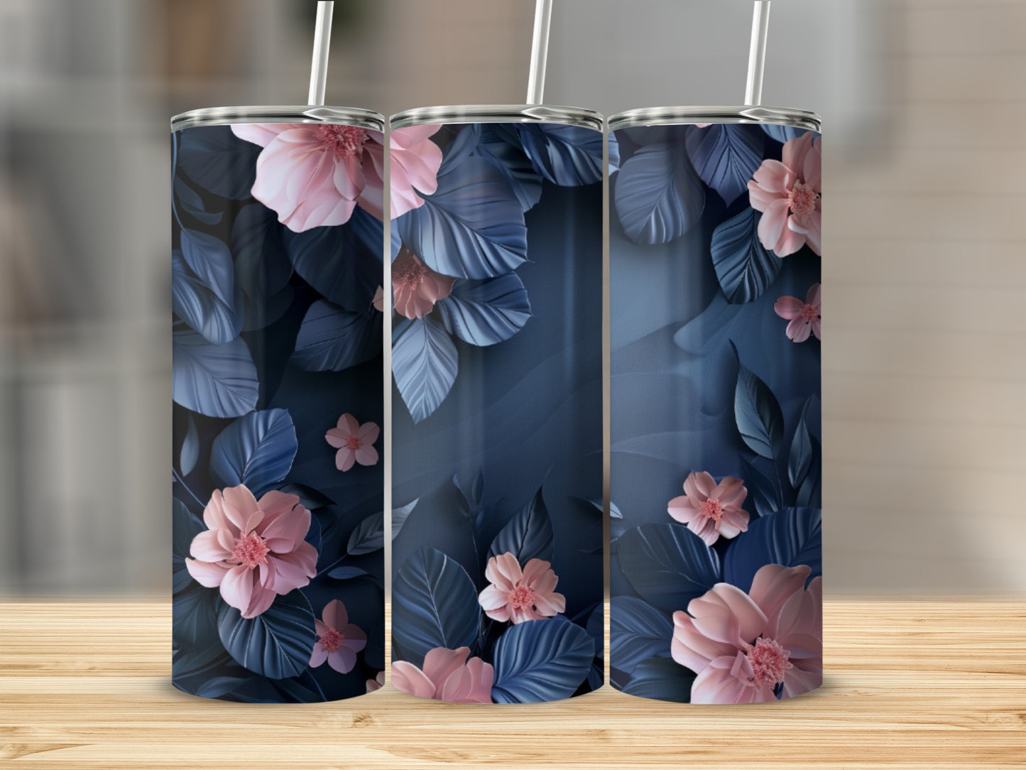 Three dark blue tumblers with pink flowers and leaves.