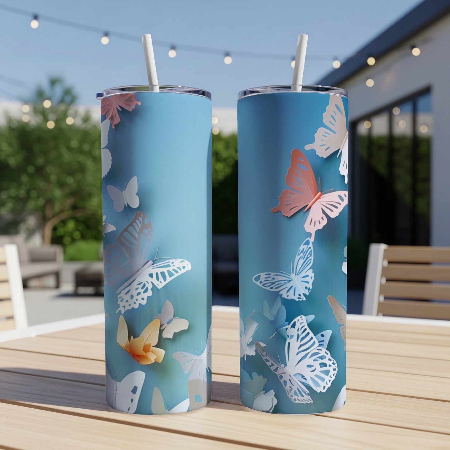 Two tall, slim tumblers with a pale blue background and a butterfly design.