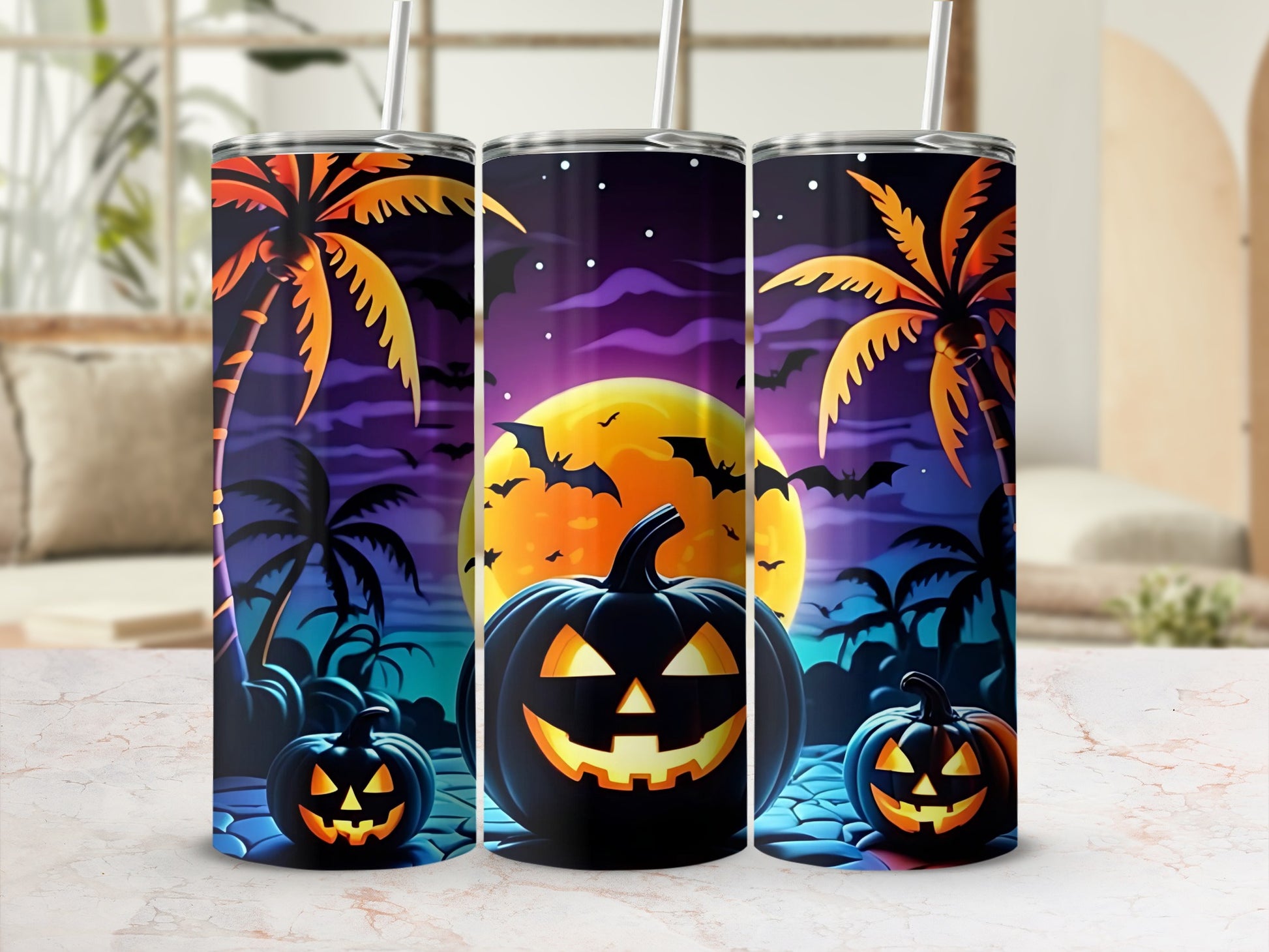 Three tumblers with a Halloween tropical beach scene and jack-o'-lanterns.