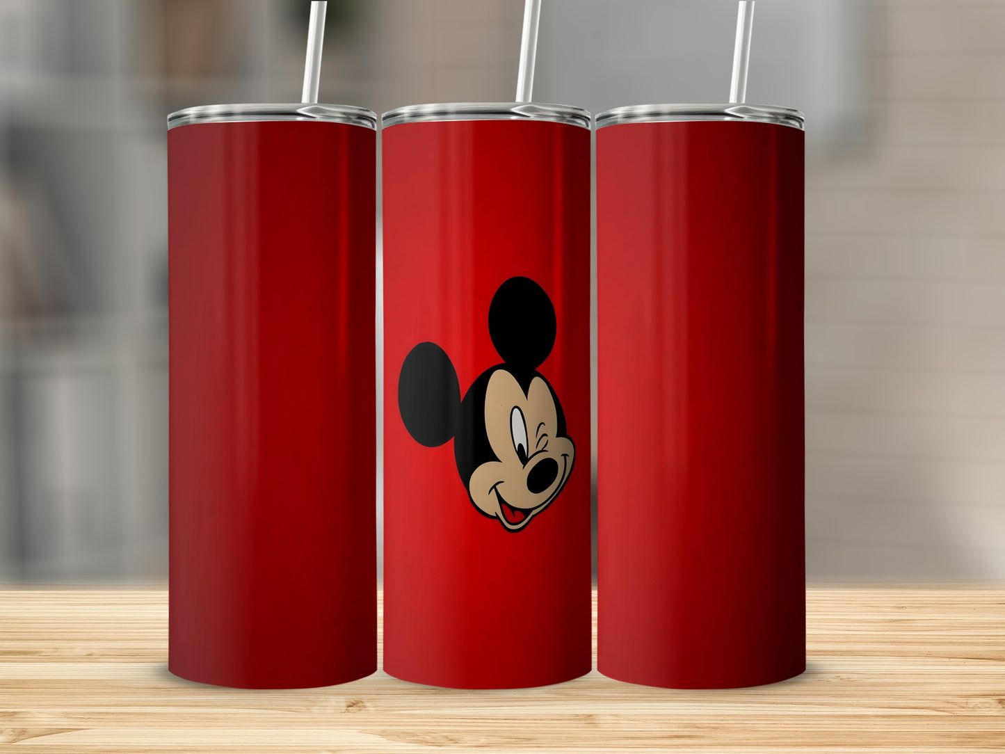 Three red tumblers, one with Mickey Mouse smiling.