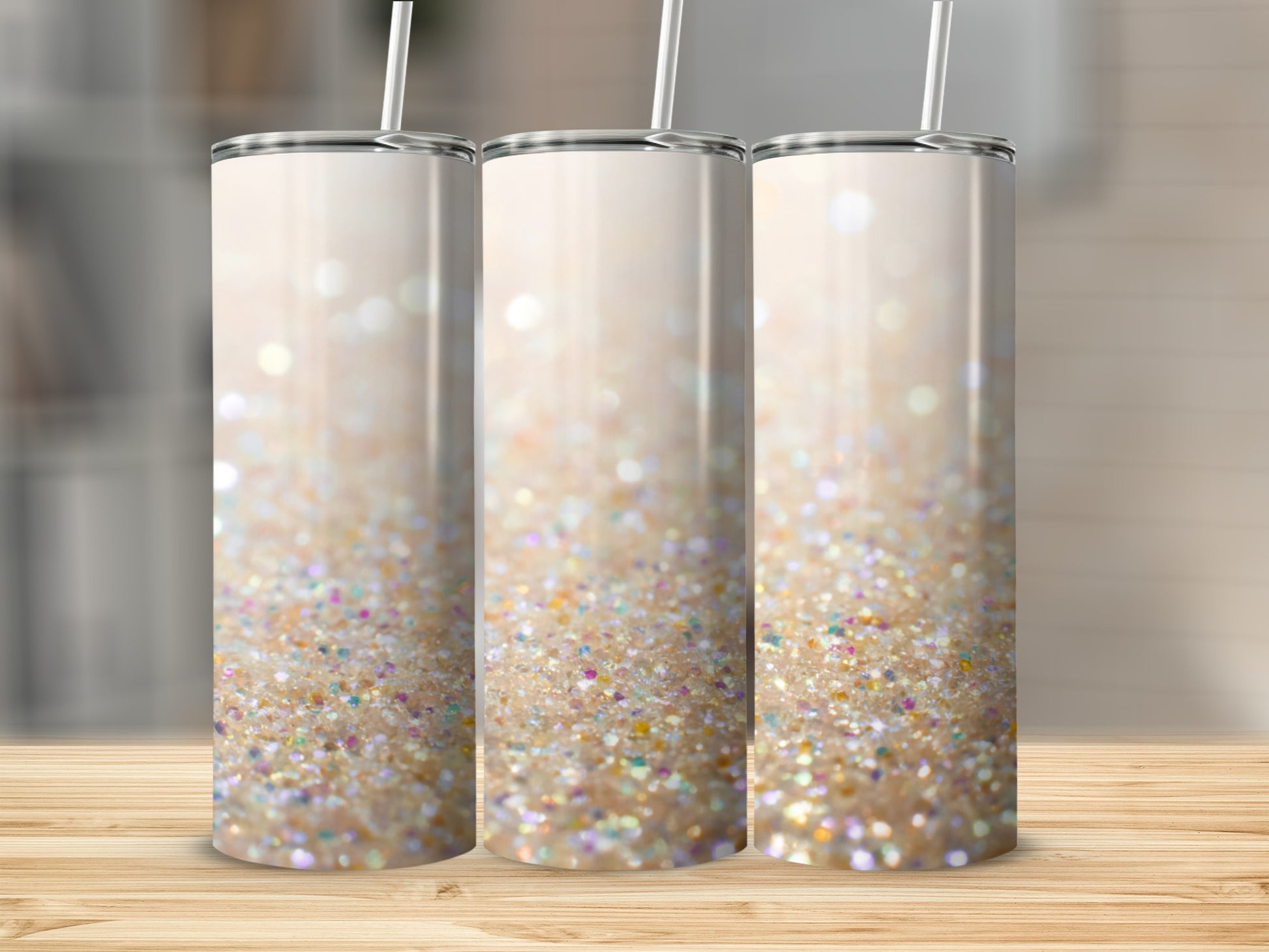 Three insulated tumblers with a shimmering glitter design.