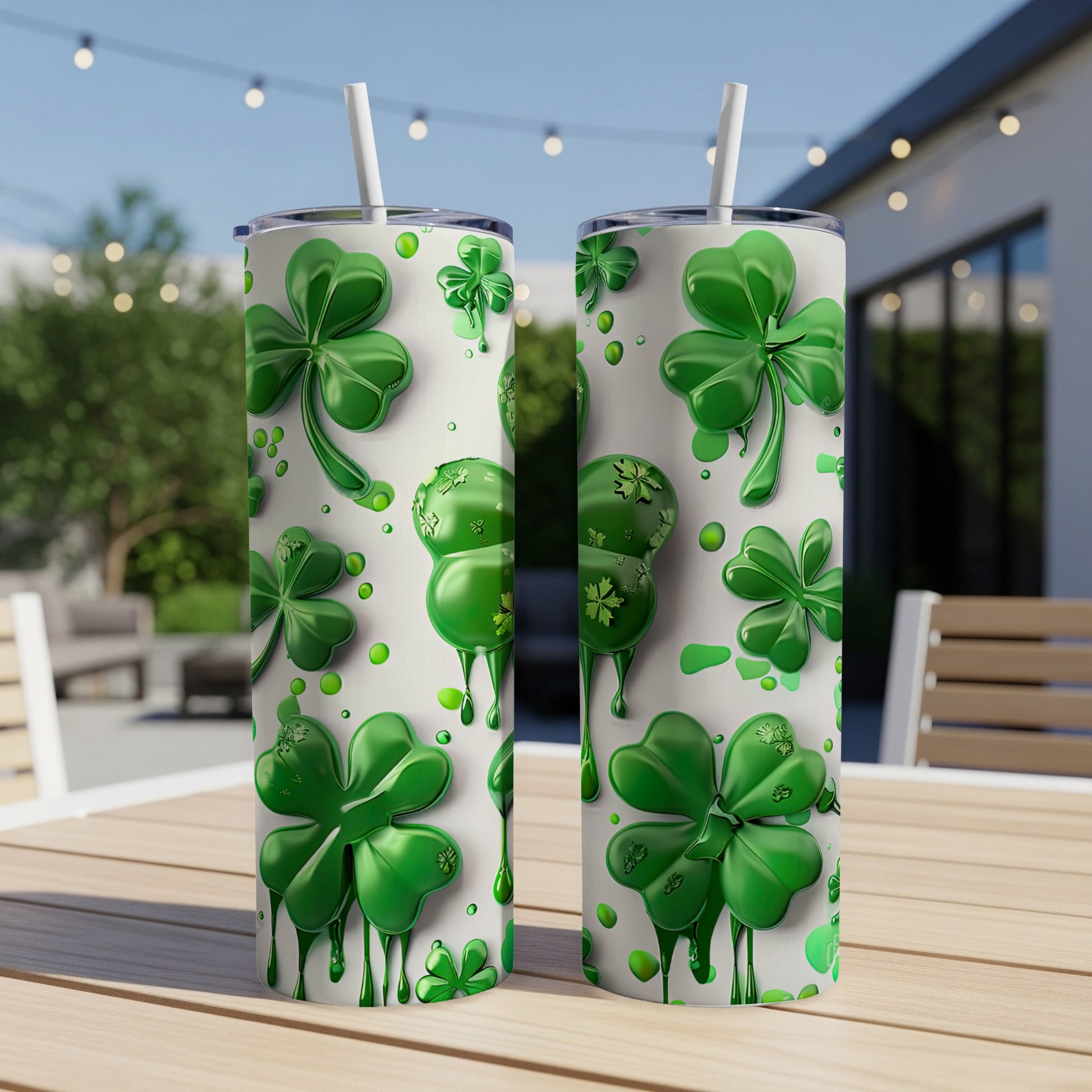White tumblers with green shamrocks and dripping green accents.
