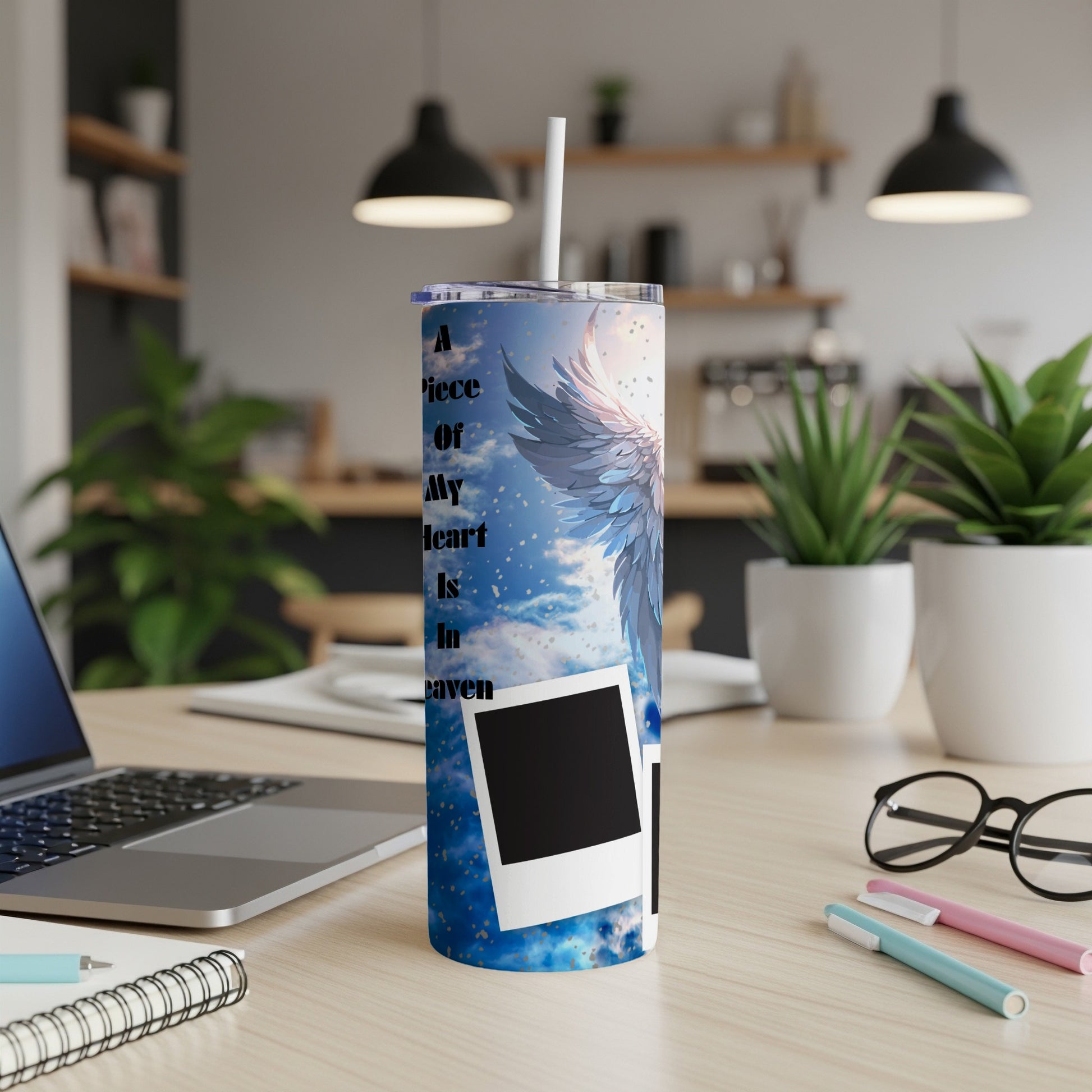 Tumbler with blue sky, angel wings, and text "A Piece Of My Heart Is In Heaven".