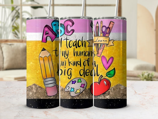 "I Teach tiny humans I'm kind of a big deal" tumbler with school supplies.
