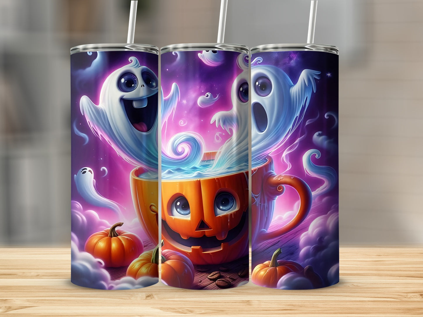 Three tumblers with a Halloween design of ghosts, a jack-o'-lantern mug, and pumpkins.