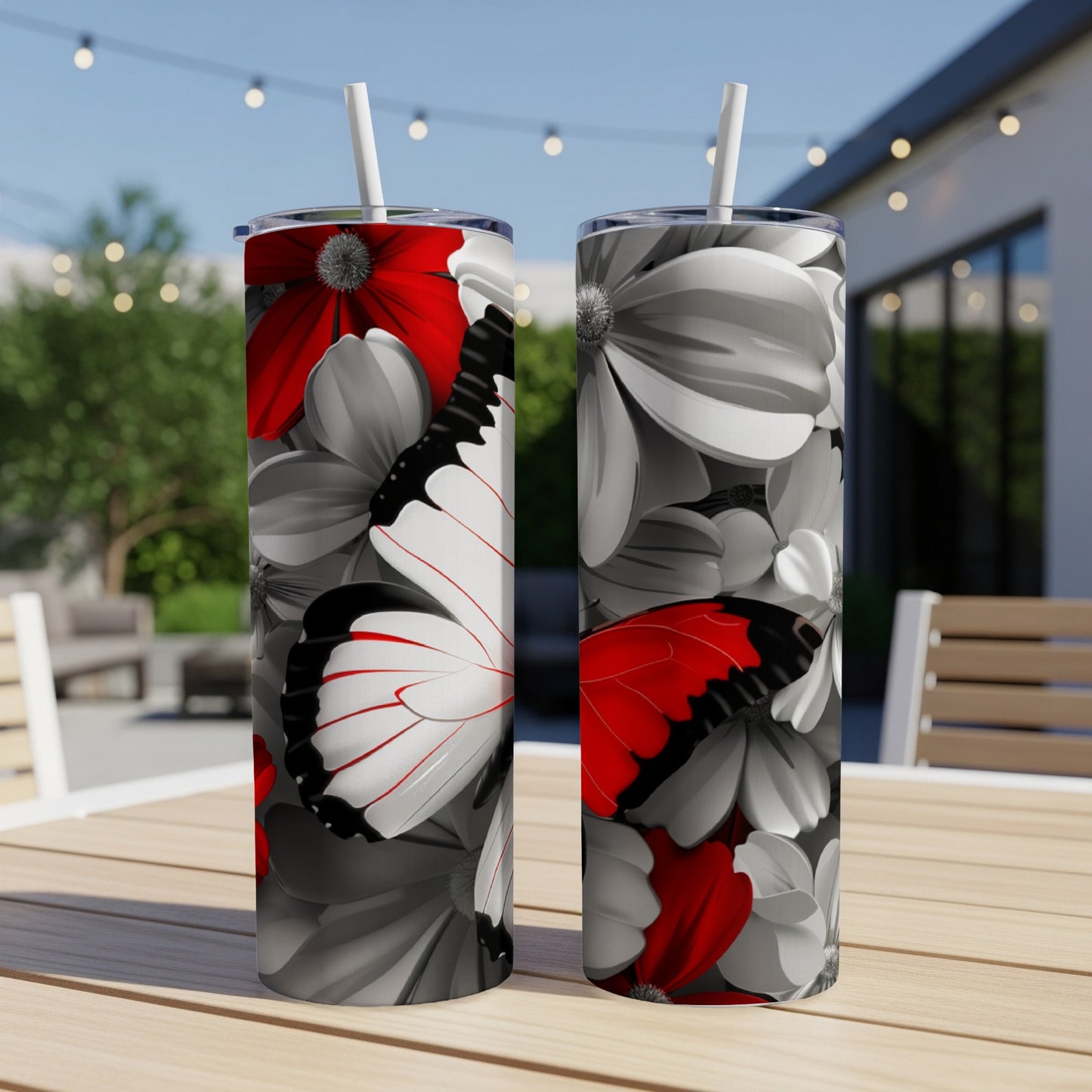 Two tumblers with a black, white, and red butterfly and floral design.