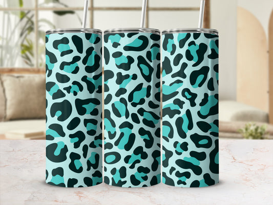 Three tumblers with teal and black leopard print and white straws.