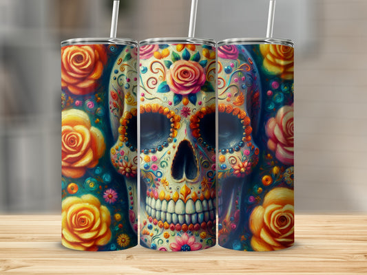 Floral skull tumbler with straw, detailed colorful design against a blurred background.