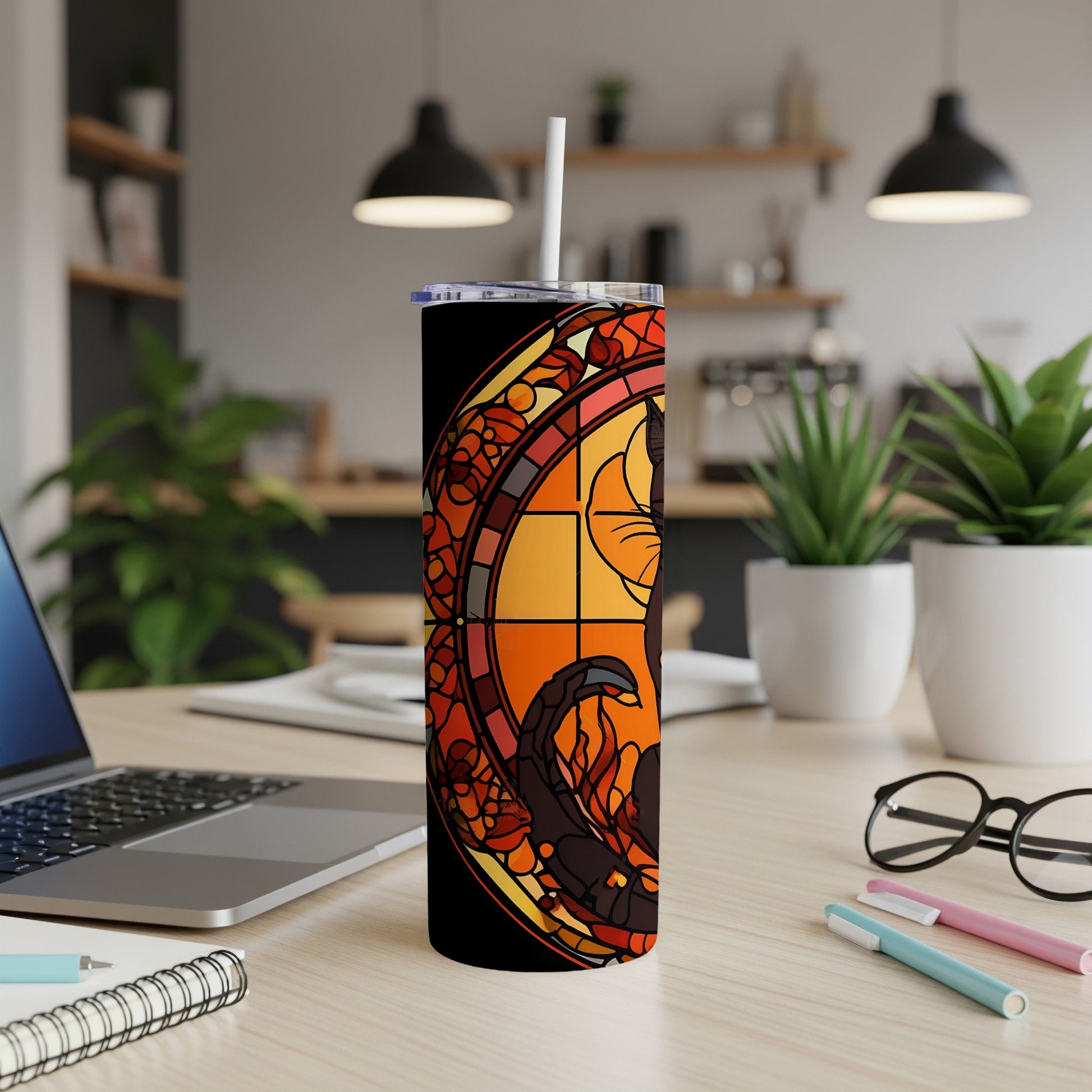 Black cat silhouette within stained glass design on a tumbler.