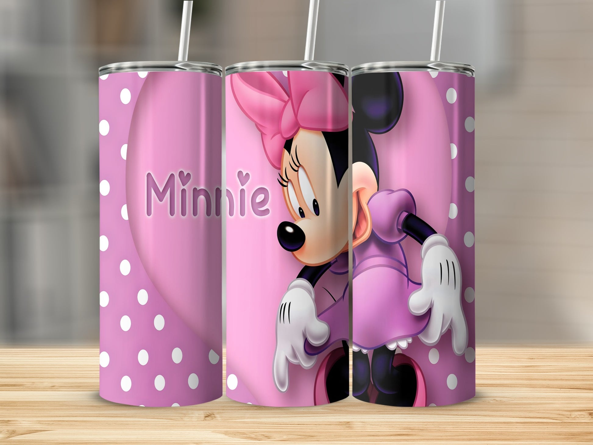 Minnie Mouse on a pink polka dot tumbler with a large heart.