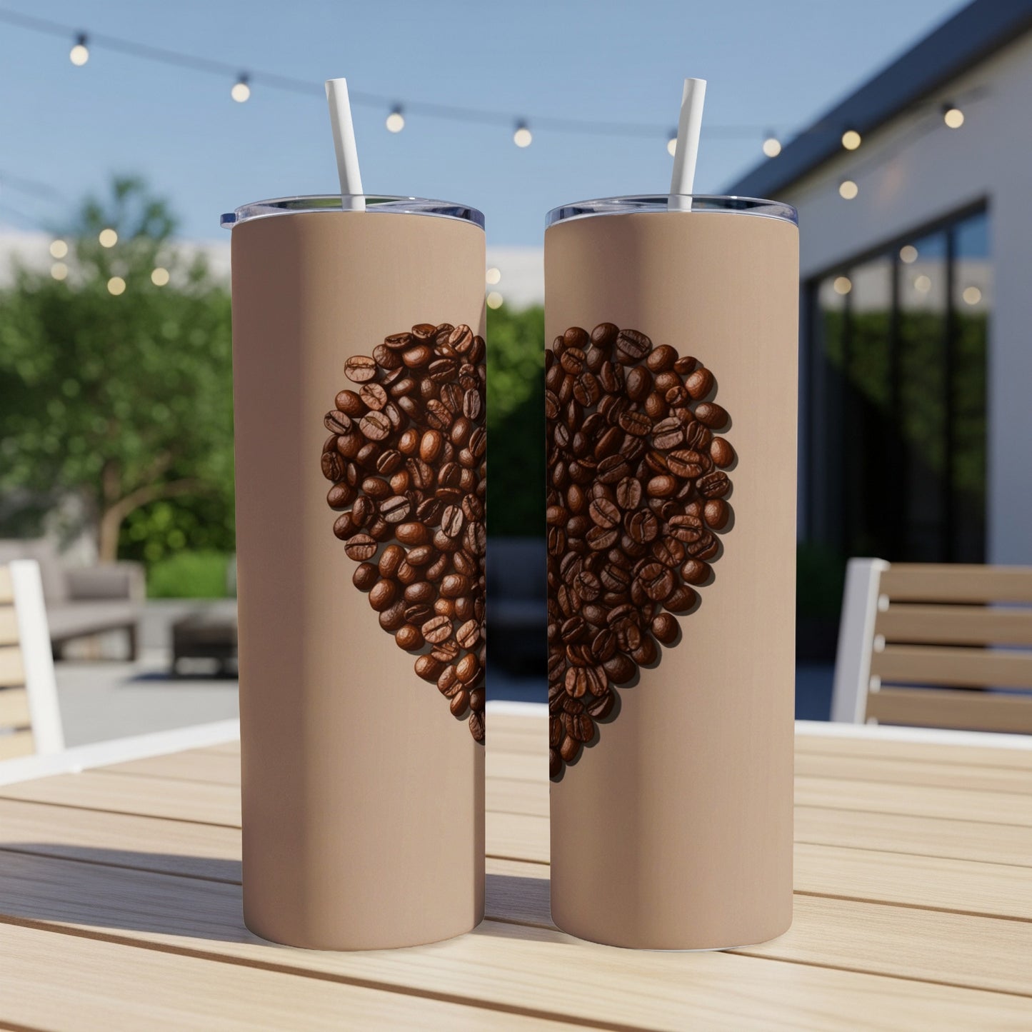 Two tall, brown tumblers with a coffee bean heart design.