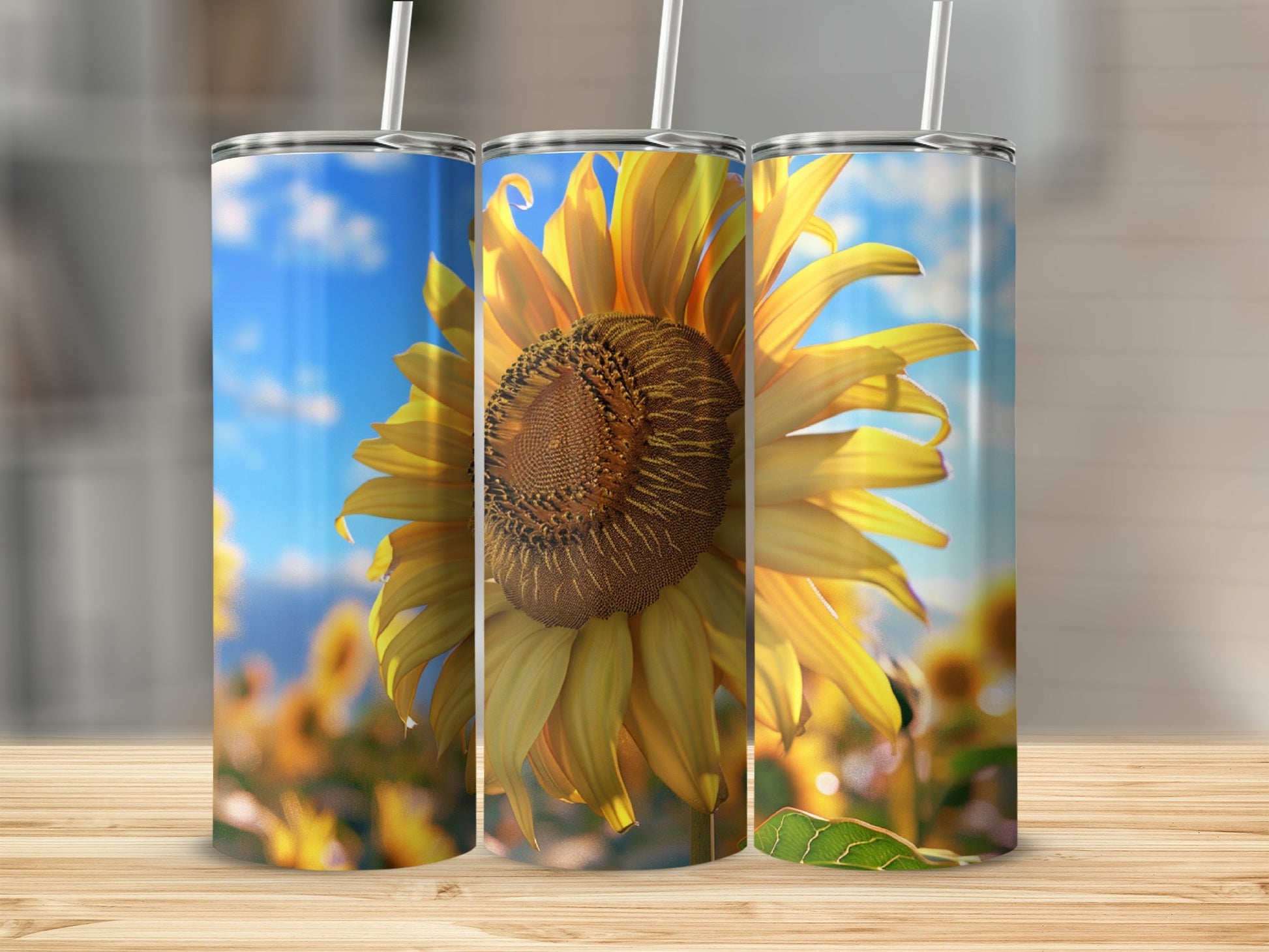 Three tumblers featuring a close-up sunflower against a blue sky.