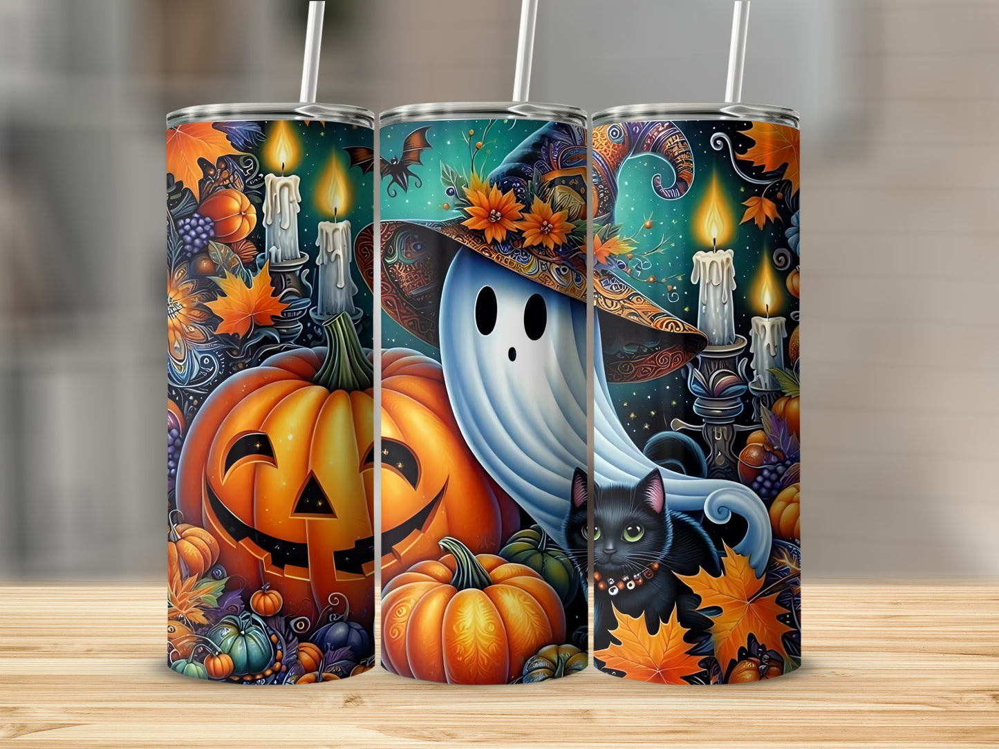 Three Halloween-themed tumblers with pumpkins, a ghost, a black cat, and autumn leaves.