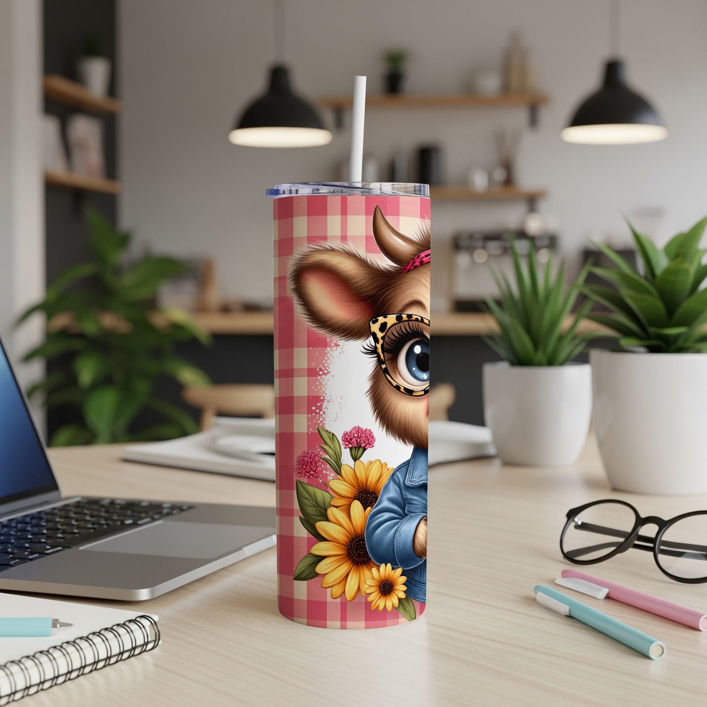Cute cow with sunflowers on a pink plaid tumbler.