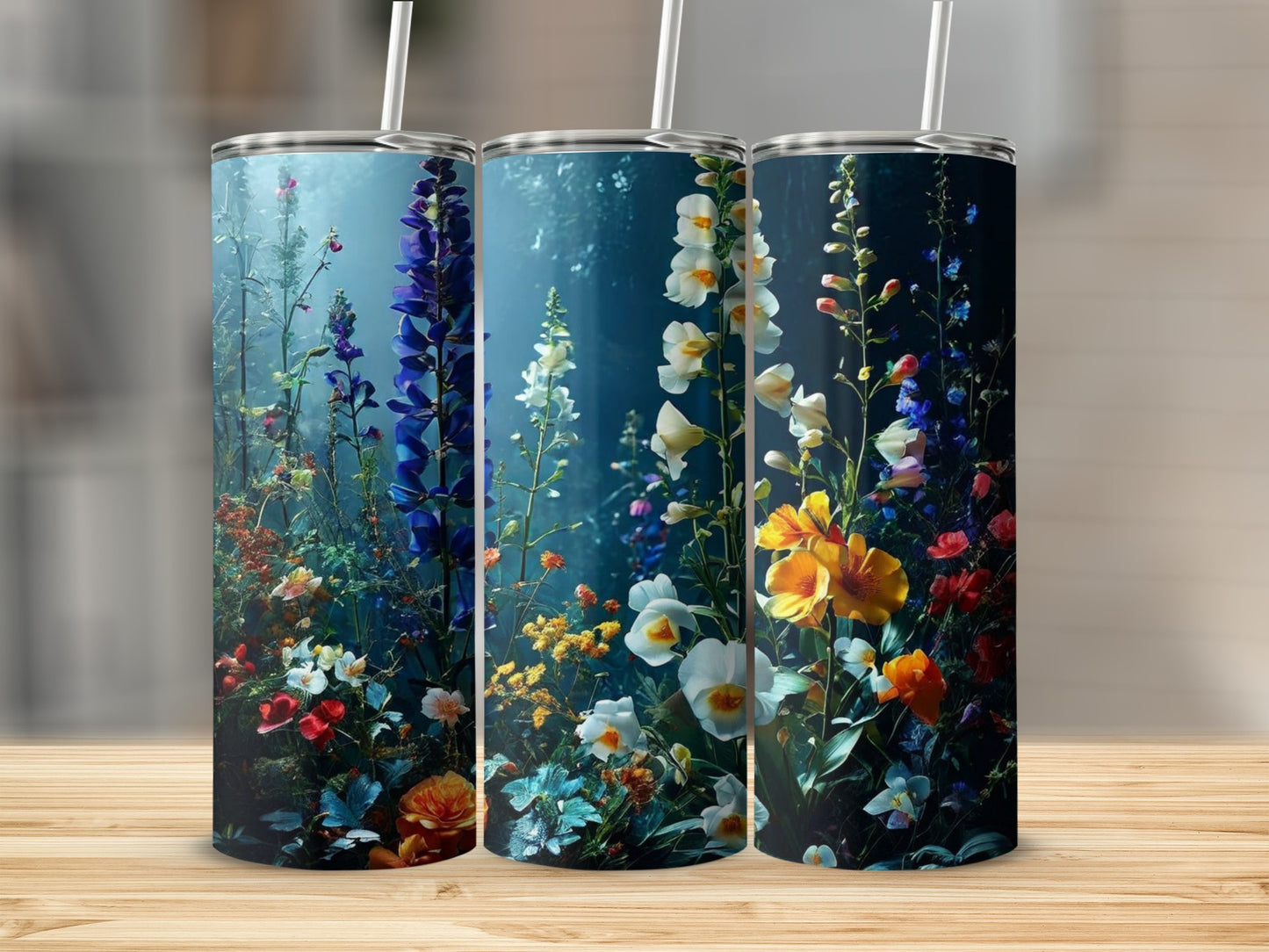 Three tall tumblers decorated with a vibrant, dark floral design.