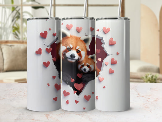 Two red pandas peek through a heart-shaped tear on a white tumbler.