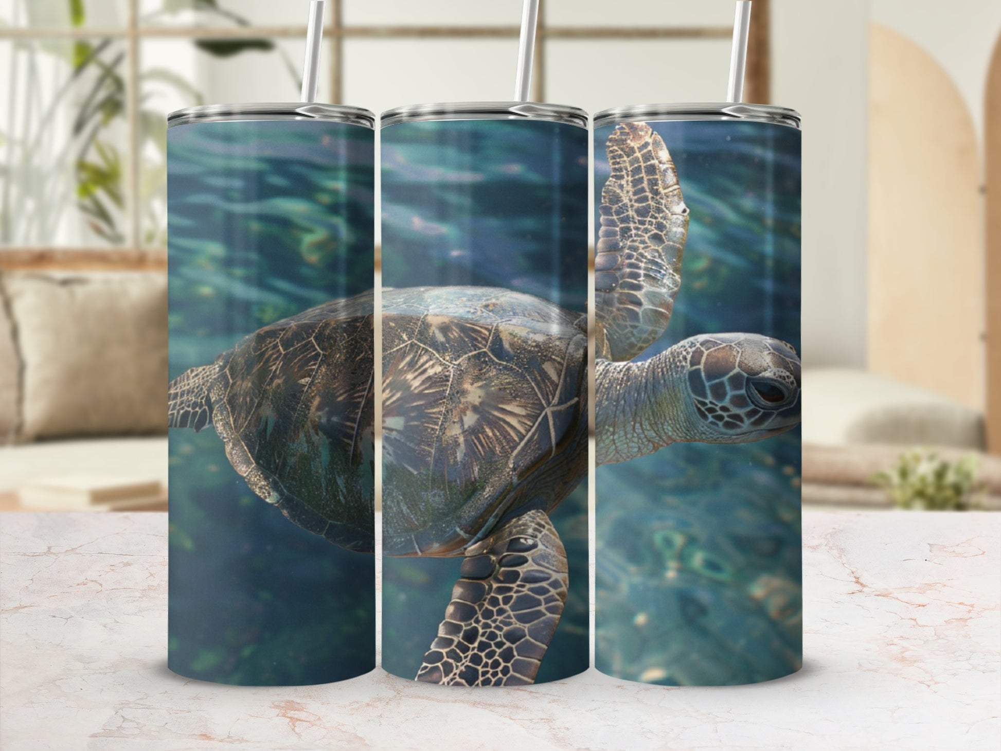 Sea turtle swimming underwater, shown on three tumblers.