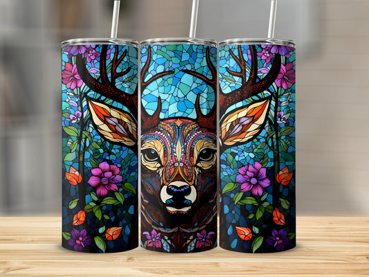 Stained glass deer head with colorful flowers and foliage on a tumbler.