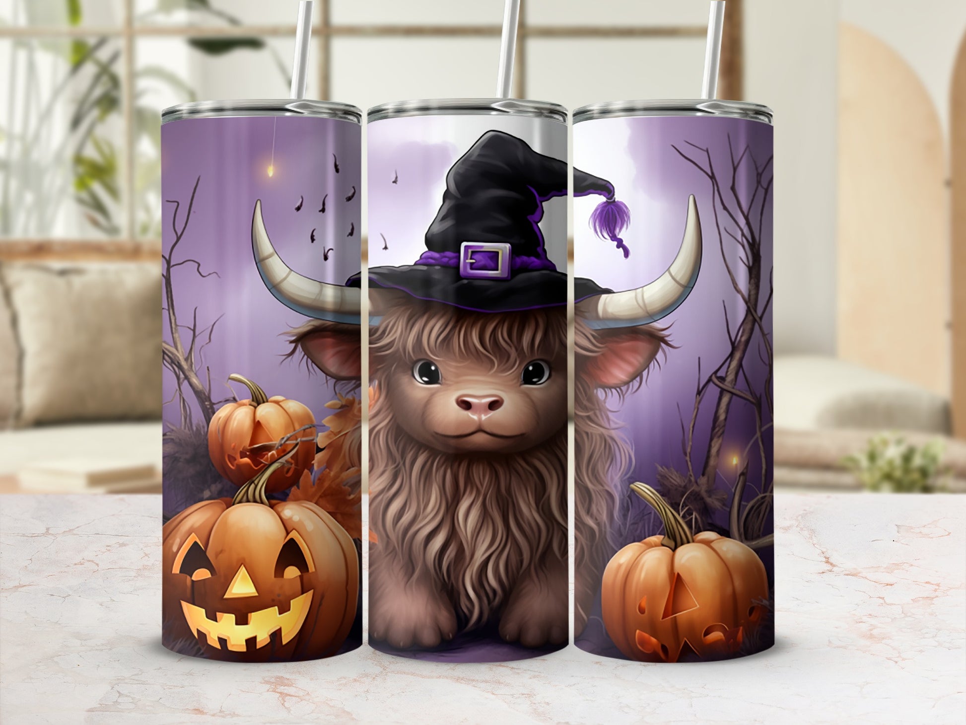 Three tumblers with a Halloween highland cow design featuring pumpkins and a witch hat.
