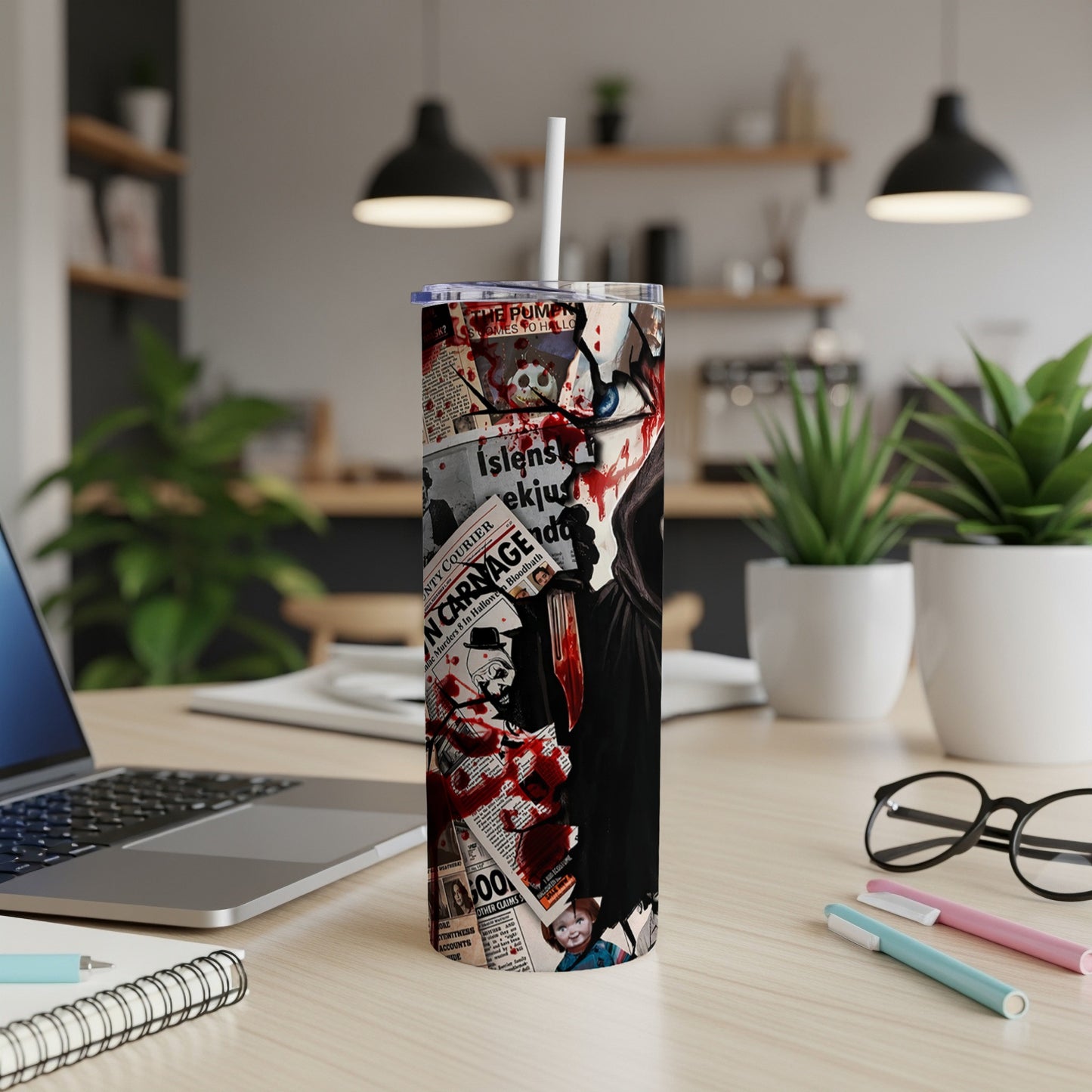 Tumbler with horror movie collage featuring Chucky and newspaper headlines.