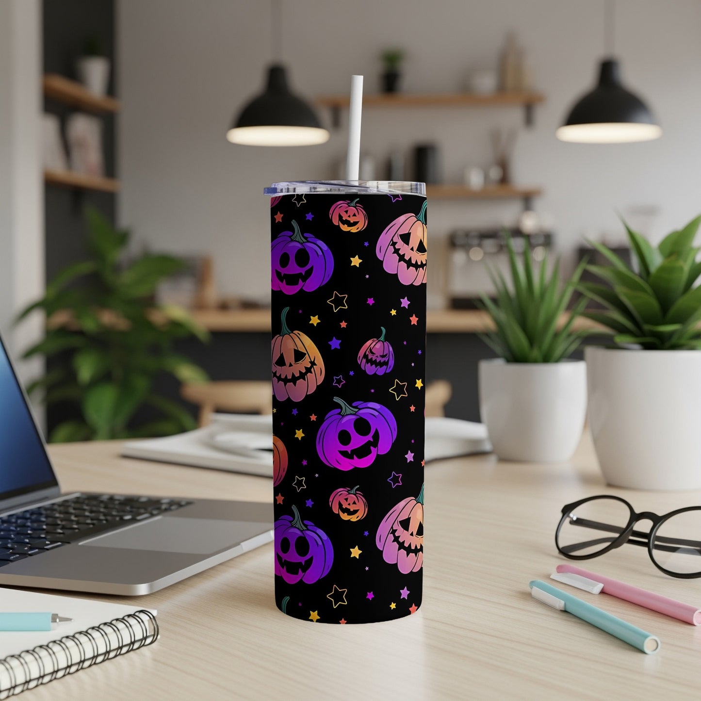 Black tumbler with colorful gradient jack-o'-lanterns and stars pattern.