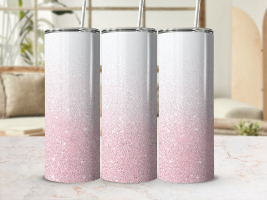Three glitter ombre tumblers with straws in a light pink gradient.