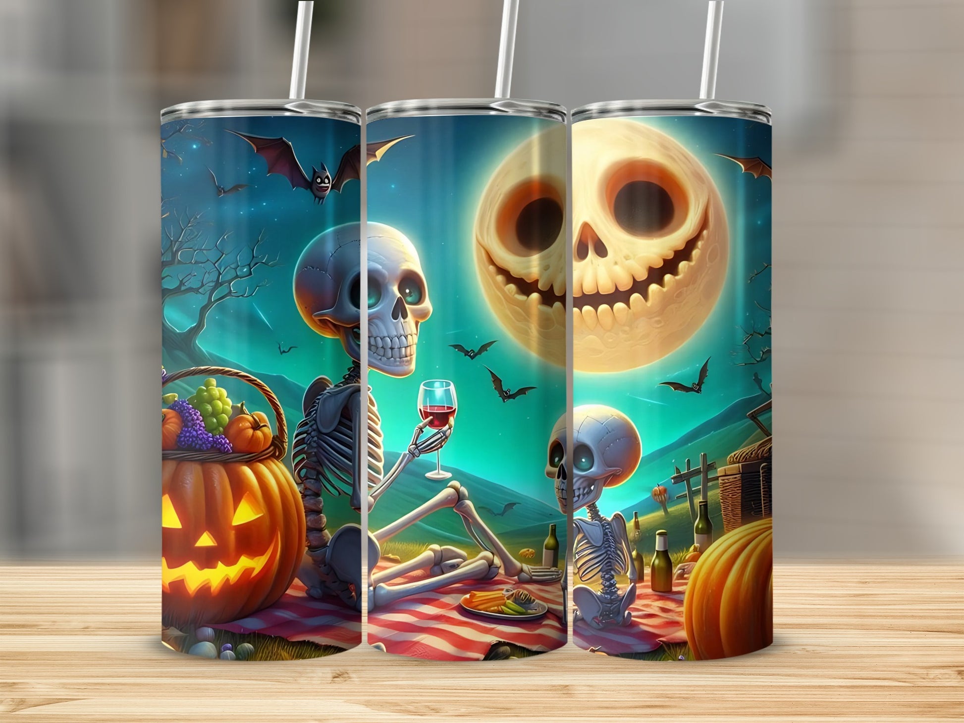 Halloween tumblers featuring skeletons, bats, and a spooky moon scene.