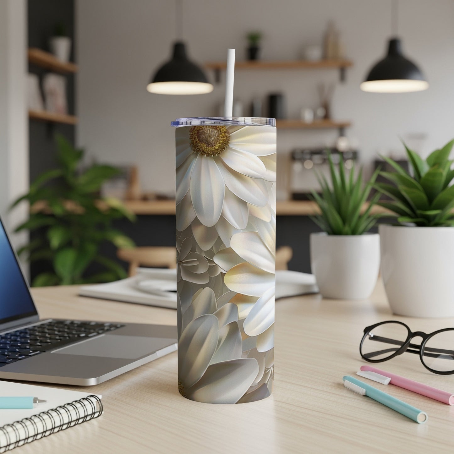 White daisy flower pattern on a stainless steel tumbler with straw.