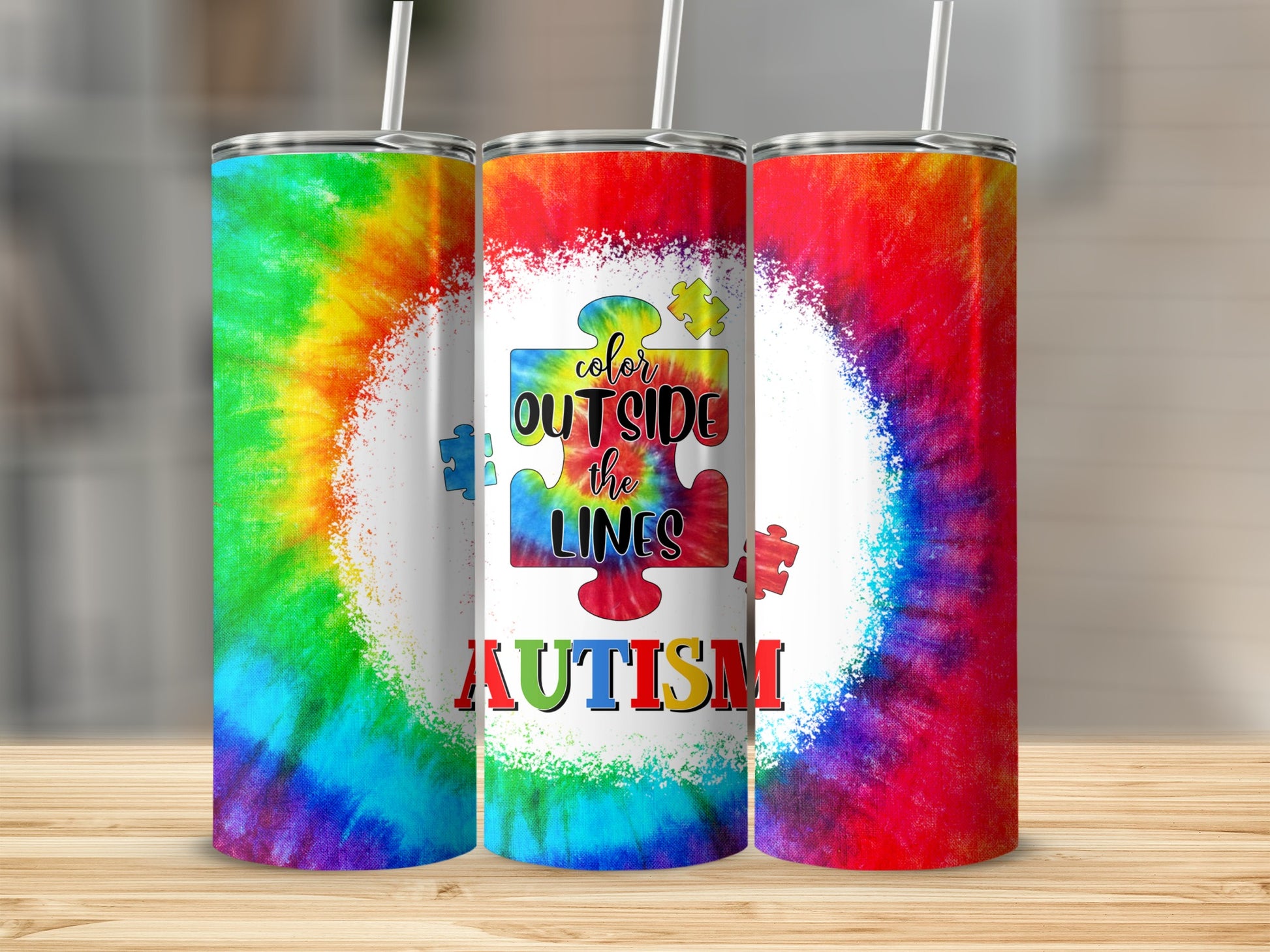 Tie-dye tumbler with "Color Outside the Lines Autism" text and puzzle pieces.