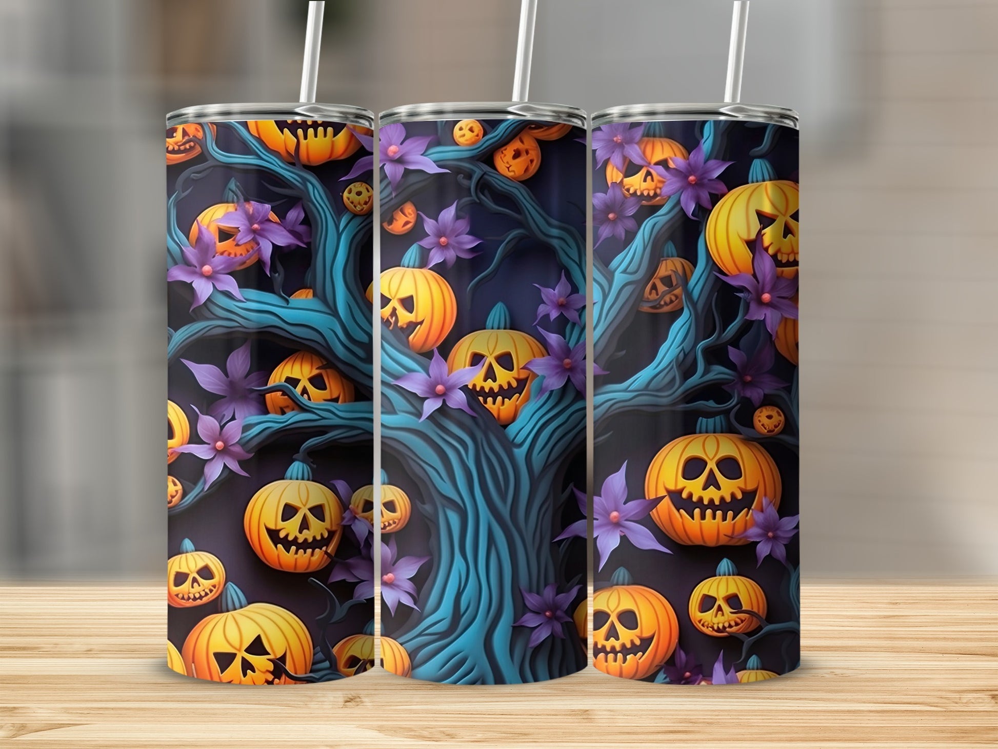 Three tumblers with a Halloween design of jack-o'-lanterns and purple flowers on a dark background.