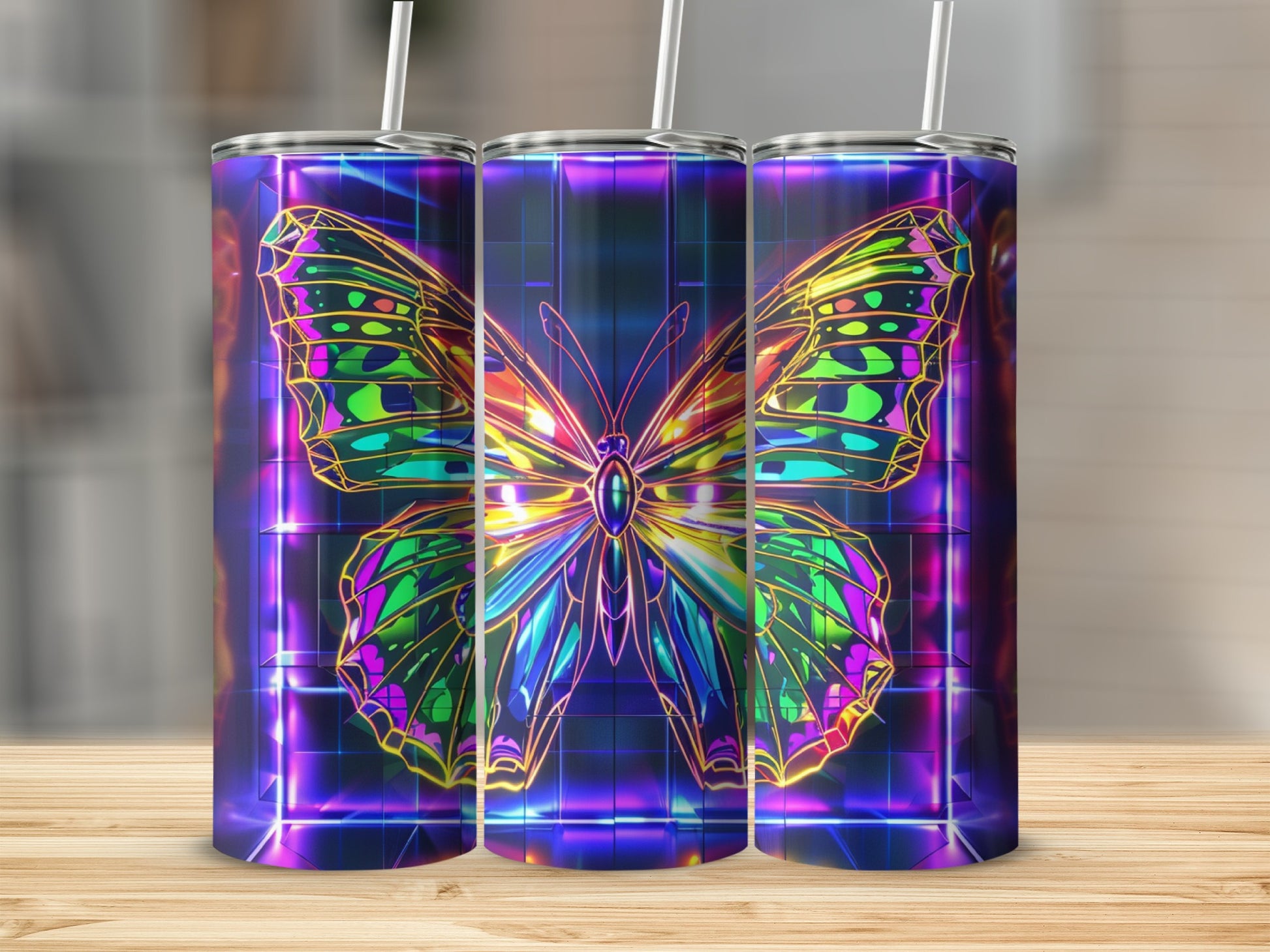 Three tumblers with a neon butterfly design on a wooden surface.