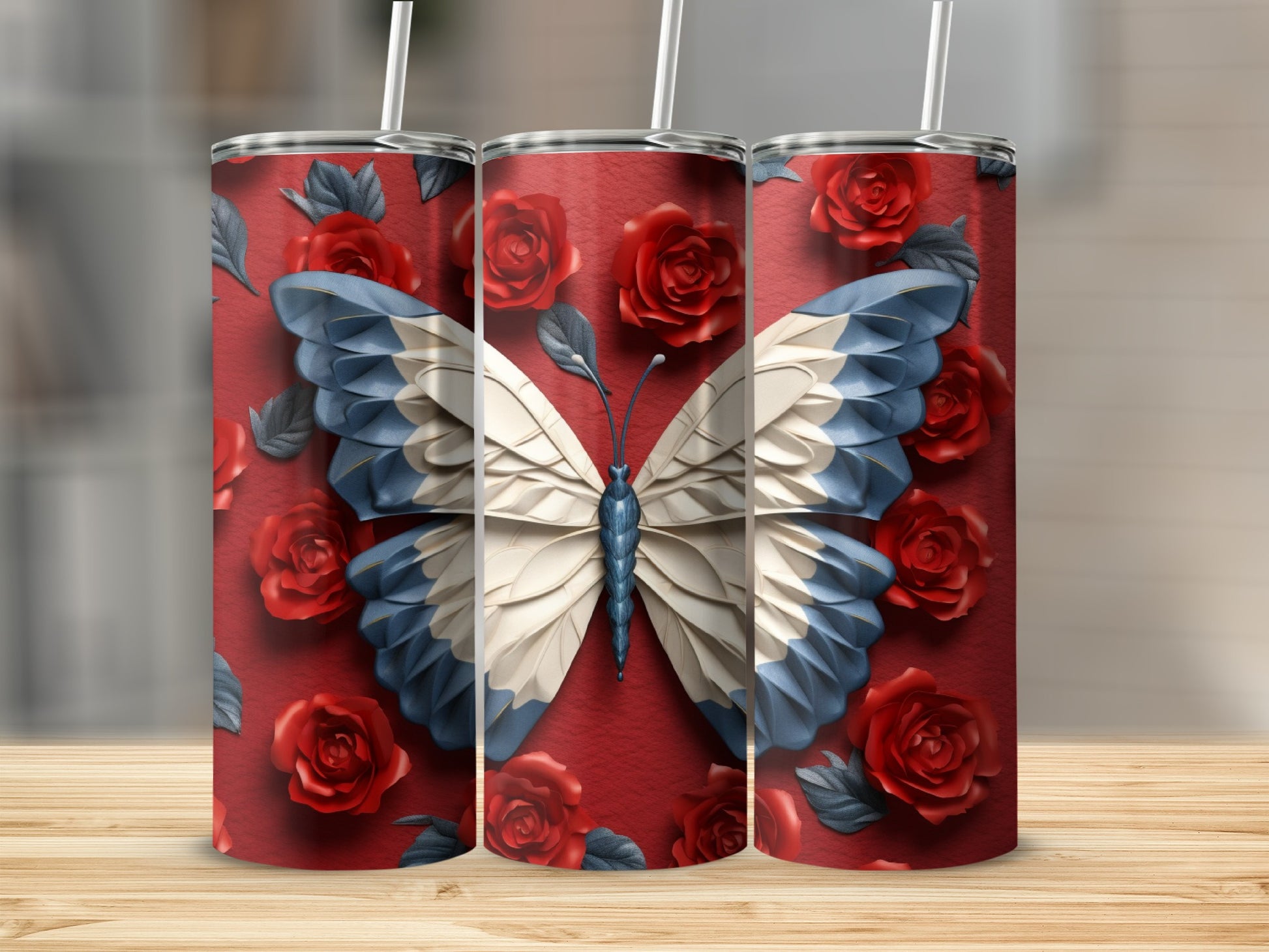 Three tumblers with a butterfly and red roses design.