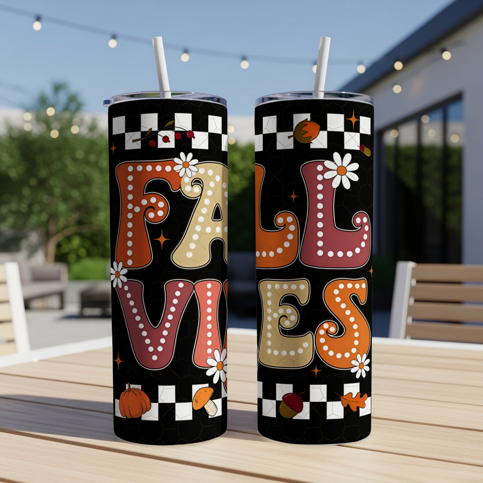 Black tumbler with "Fall Vibes" text and autumn motifs.