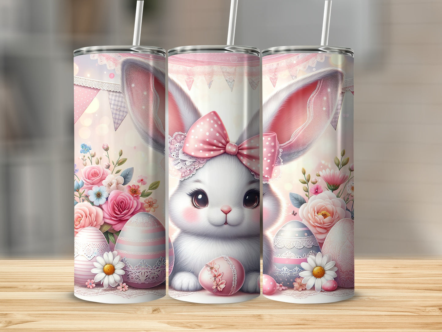 Easter bunny with pink bow, decorated eggs, and floral accents on tumblers.
