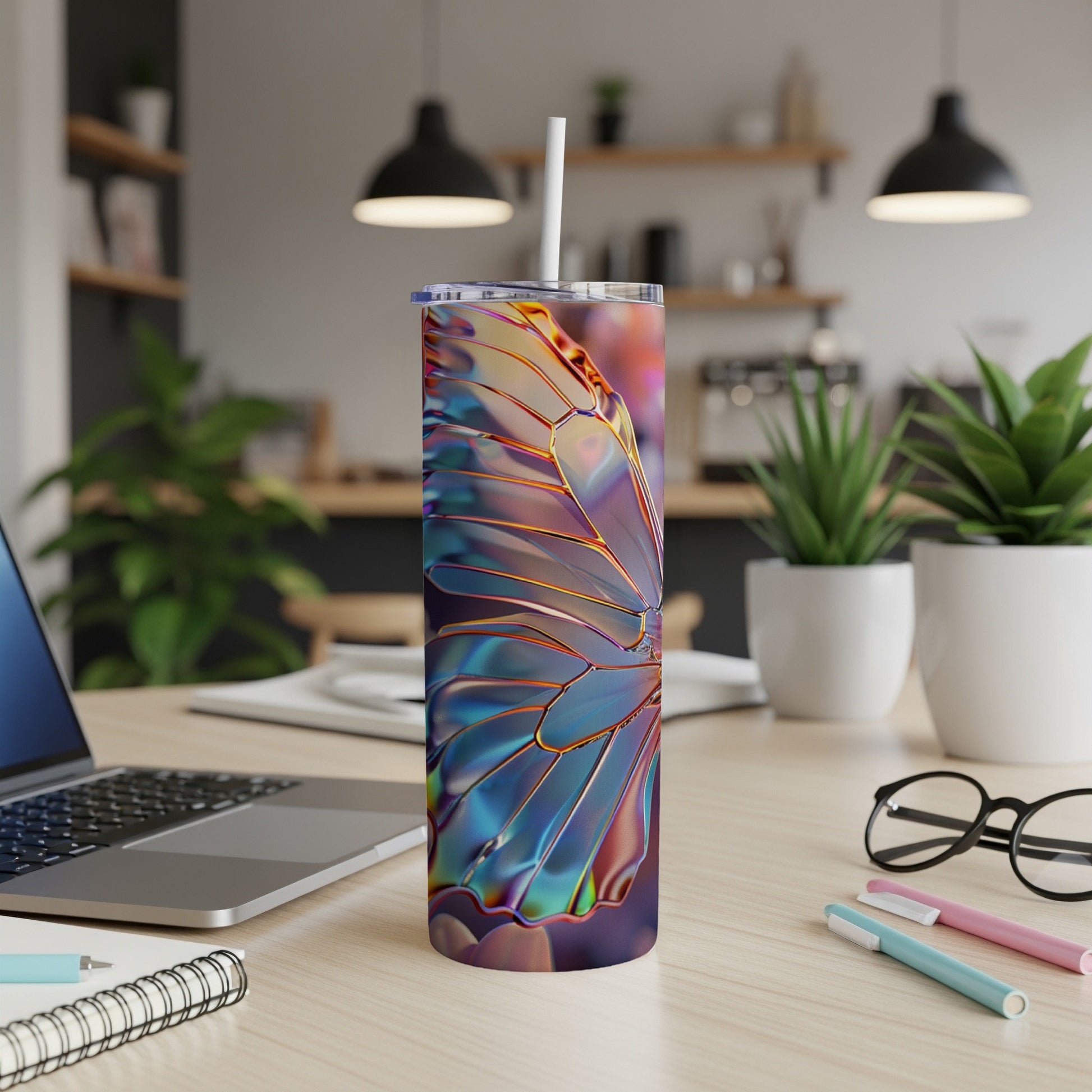 Iridescent butterfly wing pattern on a skinny tumbler with straw.