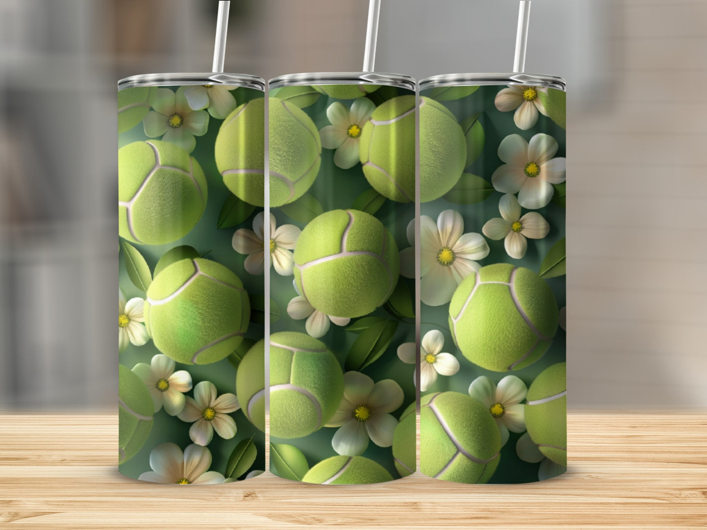 Three tumblers with tennis balls and white flowers pattern.