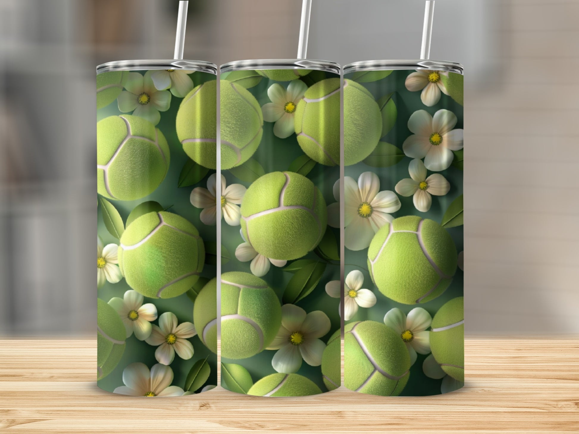 Three tumblers with tennis balls and white flowers pattern.