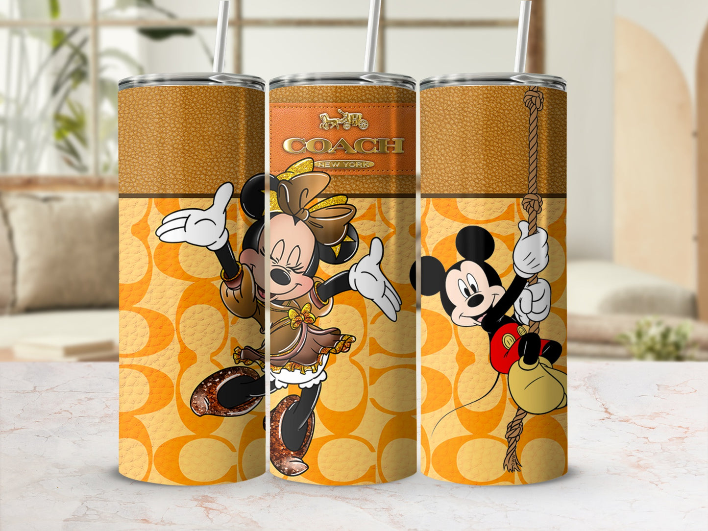 Three tumblers with Minnie and Mickey Mouse, Coach logo, and C pattern.