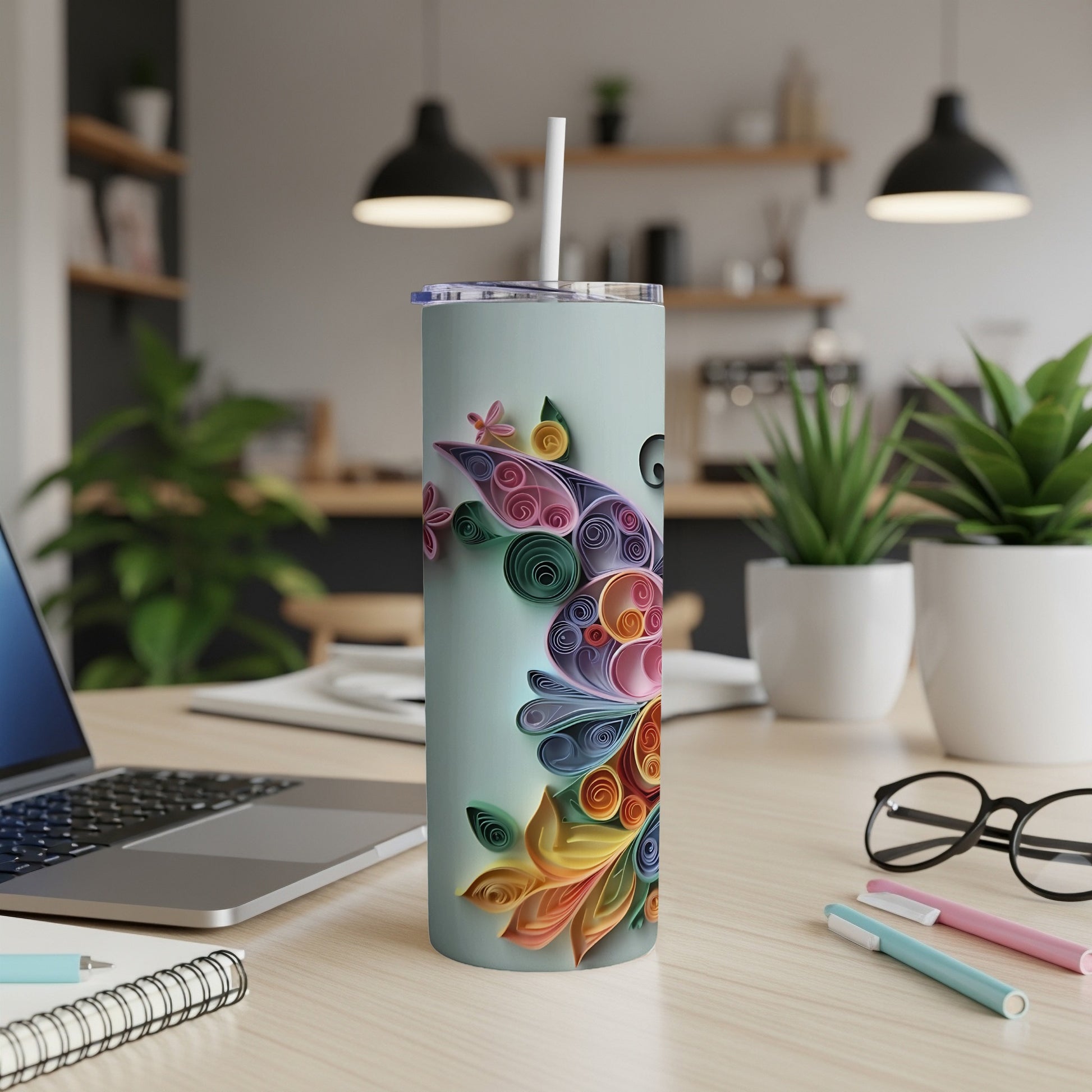 Light blue tumbler with a colorful floral quilled paper design and white straw.