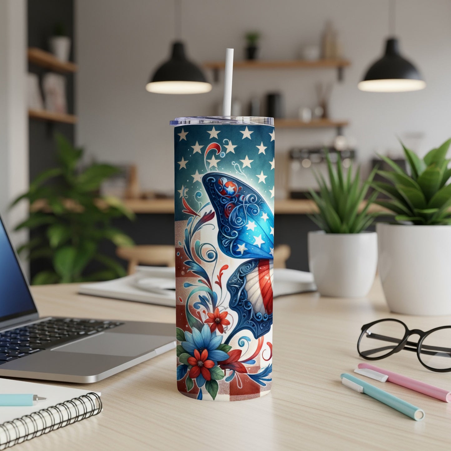 Tumbler with patriotic American flag design, stars, and floral accents.